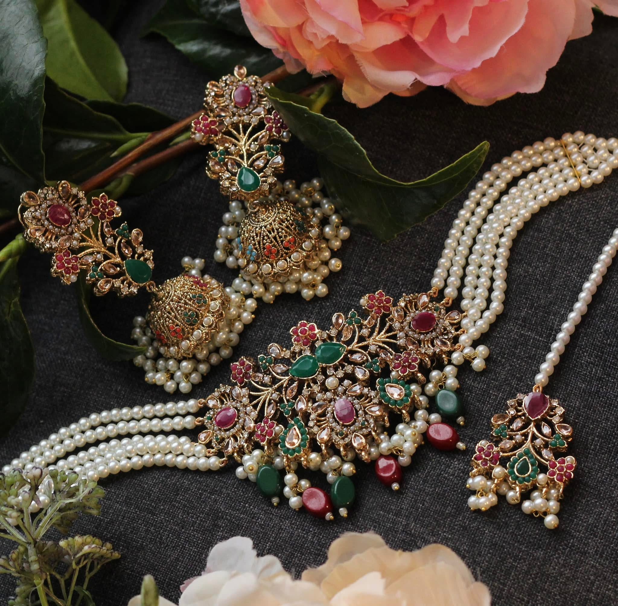 Ornate jewelry set with pearls and gemstones.